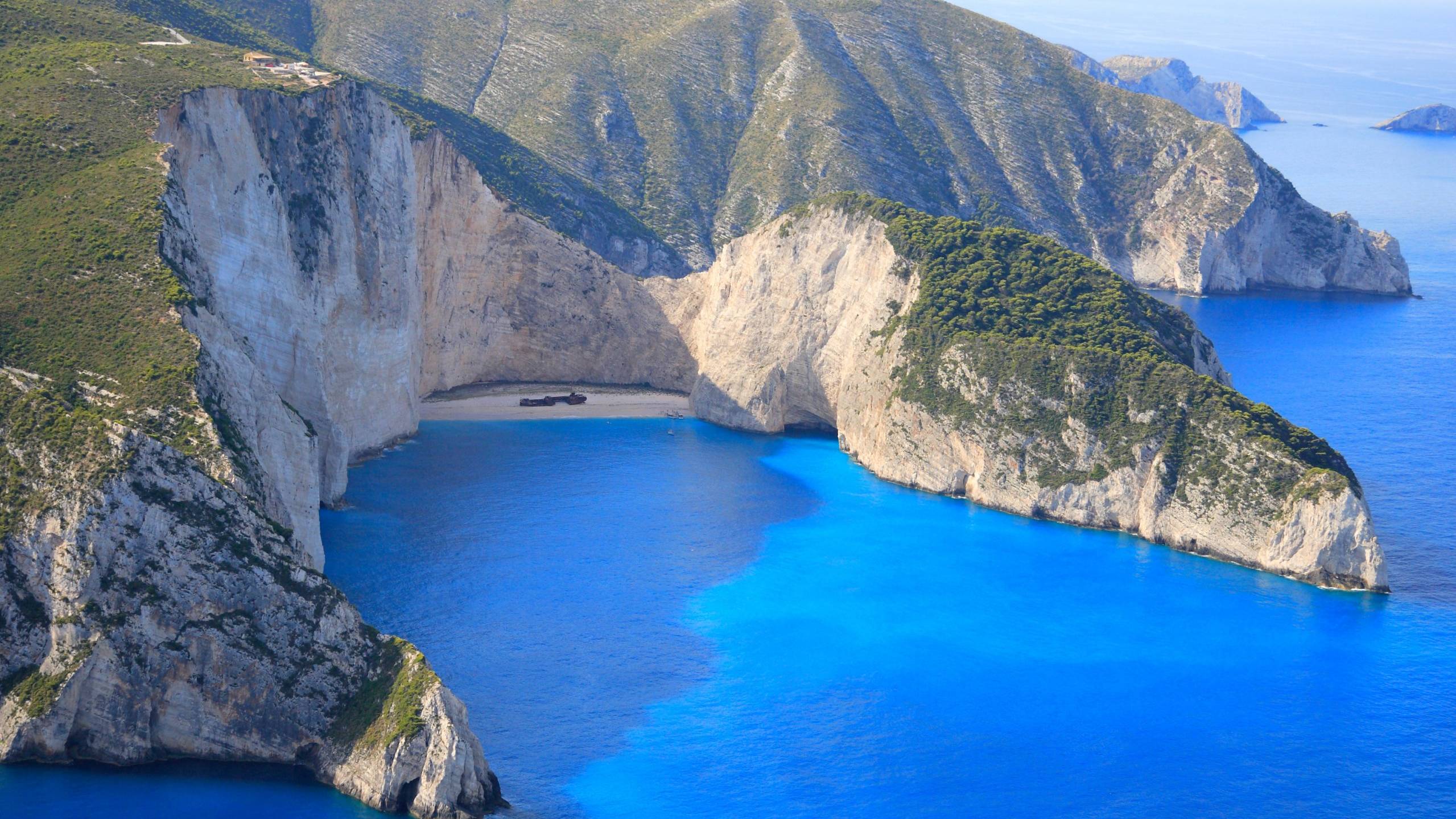 The shipwreck beach is nestled between towering white cliffs and the impossibly blue waters of the Ionian Sea.