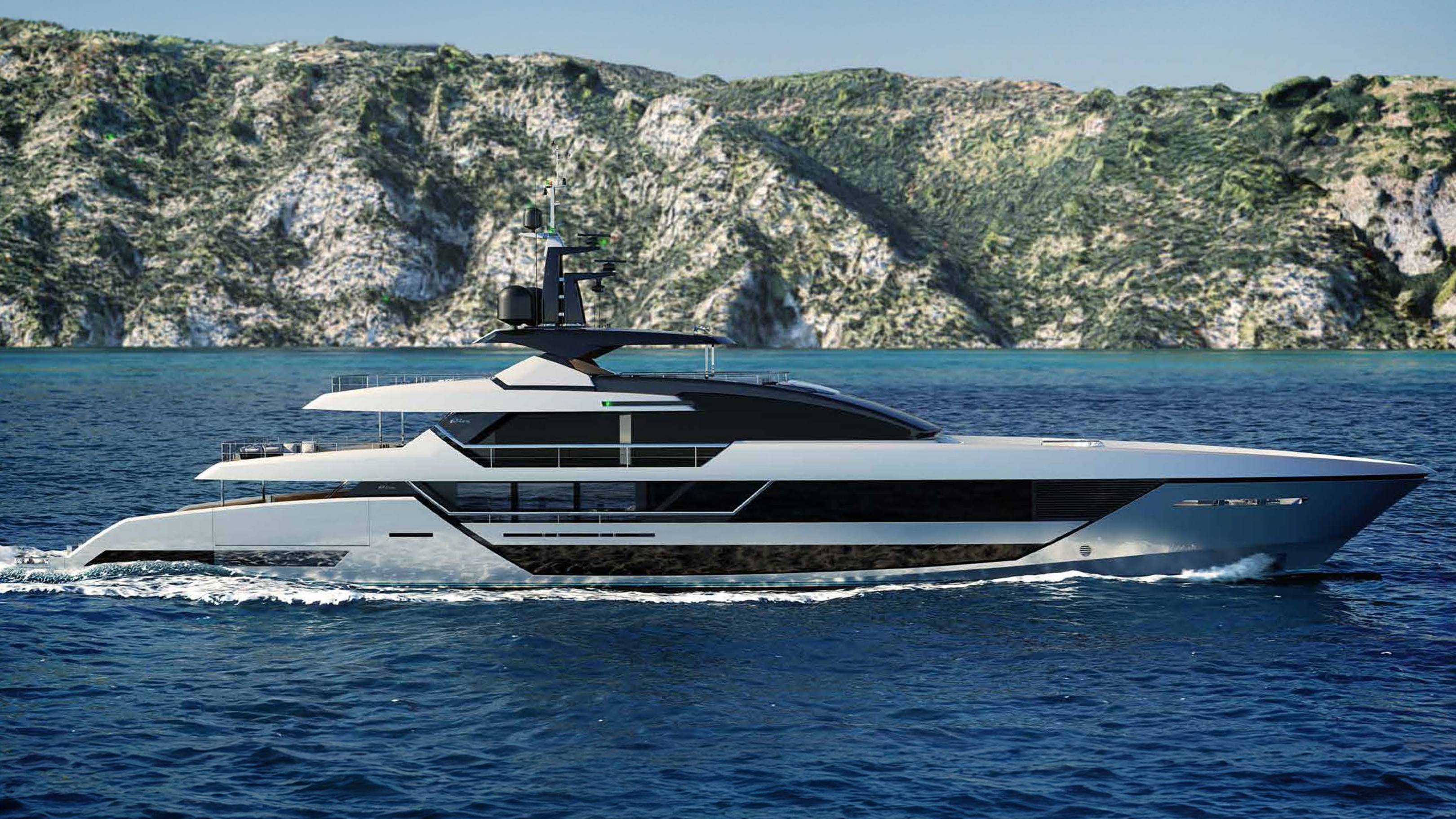 A sleek, modern yacht glides through the deep blue ocean with a rugged, green-covered mountain range in the background.