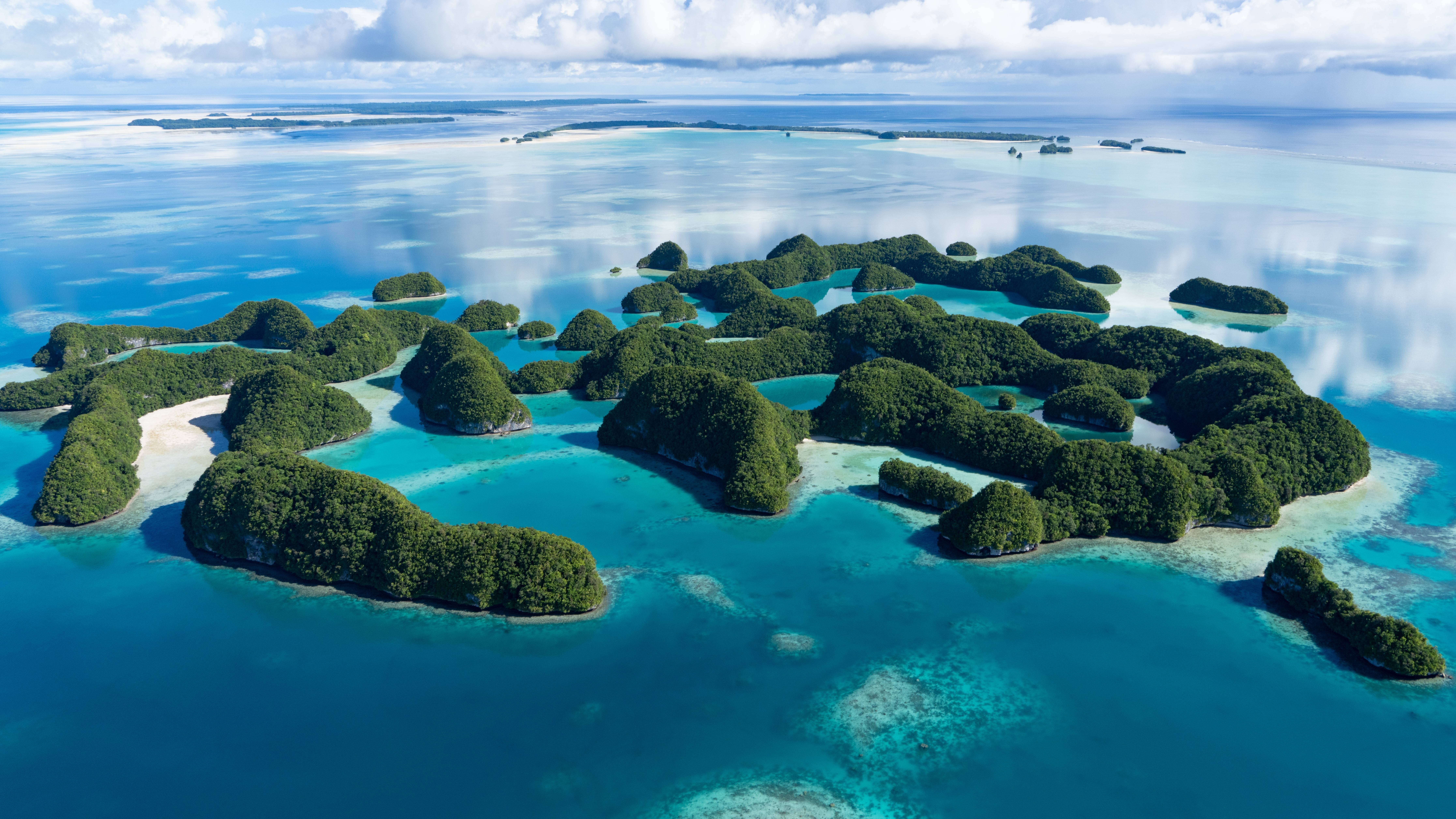 Lush green islands dot the impossibly blue waters of this tropical paradise.