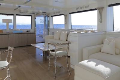 Relax in luxurious comfort aboard this yacht, with expansive windows offering breathtaking ocean views.