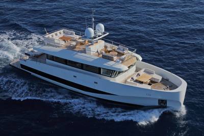 A sleek white yacht glides through the deep blue ocean, leaving a trail of white foam in its wake.