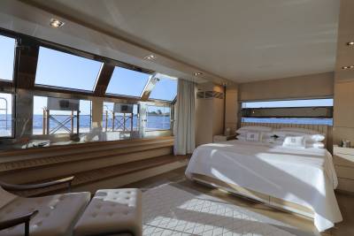 Wake up to the gentle rocking of the sea in this luxurious yacht bedroom with panoramic ocean views.