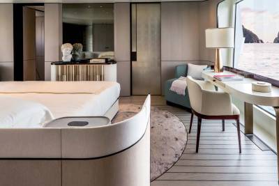 Luxurious yacht cabin offers a serene retreat with stunning ocean views and elegant furnishings.