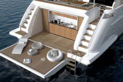 Relax on the spacious aft deck of this luxurious yacht, complete with comfortable seating and a convenient swim ladder.