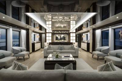 Luxurious yacht interiors feature plush seating and elegant decor, reflecting a sophisticated ambiance.