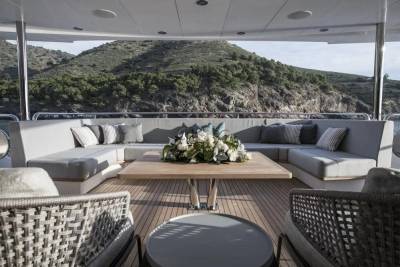 Relax on the luxurious deck of this yacht, surrounded by stunning natural scenery.