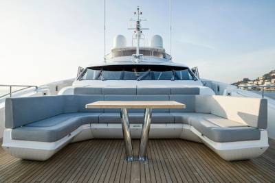 Luxurious yacht seating offers a prime spot for enjoying the sun-drenched Mediterranean coastline.