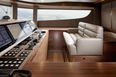 Luxurious yacht bridge offers panoramic views and advanced navigation systems for a sophisticated maritime experience.