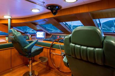 Luxurious captain's chairs and polished wood create an elegant helm on this sophisticated yacht.