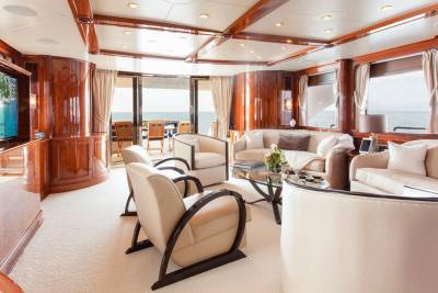 Luxurious yacht interiors offer a serene escape with plush seating and panoramic ocean views.