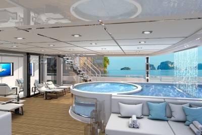 Relax in a luxurious jacuzzi and pool area with stunning ocean views and a cascading waterfall.