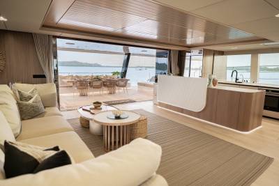 Luxurious yacht interiors seamlessly blend with outdoor living spaces, offering breathtaking ocean views and elegant dining.