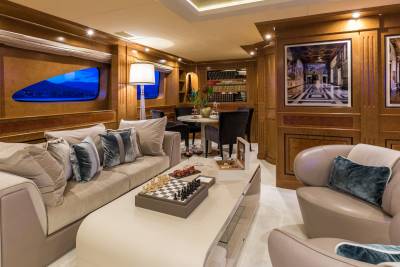 Luxurious yacht interiors offer a serene escape with elegant furnishings, captivating artwork, and stunning ocean views.