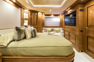 Luxurious wood paneling and plush furnishings create an opulent retreat aboard this elegant yacht.