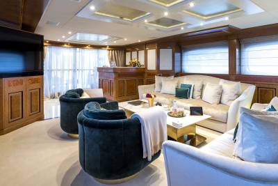 Luxurious yacht interiors feature plush seating, elegant wood paneling, and a well-stocked bar for ultimate relaxation at sea.