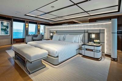 Luxurious yacht bedroom offers stunning ocean views and sophisticated design for ultimate relaxation.