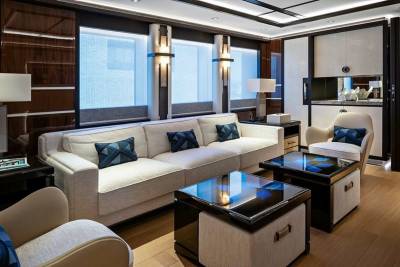 Luxurious yacht interiors feature plush seating, sleek coffee tables, and ambient lighting for ultimate relaxation.