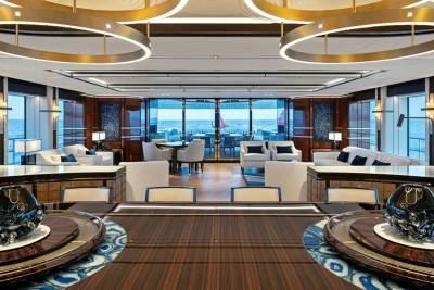 Luxurious yacht interiors open to the vast ocean, offering an elegant space for relaxation and dining at sea.
