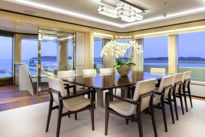 Dine in elegant style aboard this yacht, surrounded by panoramic ocean views and sophisticated interior design.