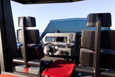 The sleek helm of a modern yacht offers a commanding view of the open sea.