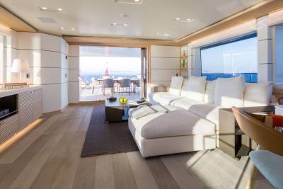 Relax in this bright and airy yacht salon with stunning ocean views and direct access to an outdoor deck.