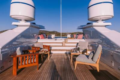 Relax on the spacious deck of this luxurious yacht, surrounded by comfortable seating and breathtaking ocean views.