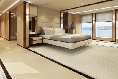 Luxurious yacht bedroom offers breathtaking ocean views and serene, modern design.