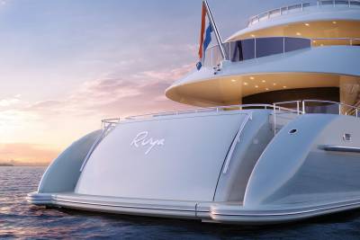 A luxurious yacht named Riya glides across calm waters under a pastel sunset sky.