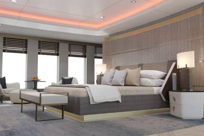 Luxurious bedroom with a king-sized bed, elegant seating, and ambient lighting creates a serene retreat.