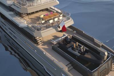 A luxurious yacht with a tender boat and outdoor dining area floats on calm blue waters.