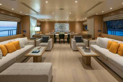 Luxurious yacht interiors offer comfortable seating and elegant dining areas with stunning ocean views.