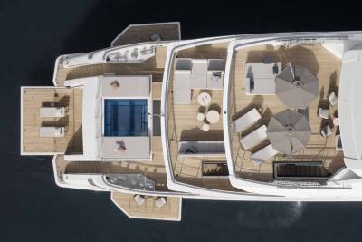 Luxurious yacht decks offer ample space for relaxation with plush seating, umbrellas, and a inviting pool.
