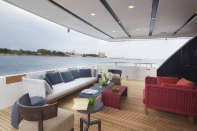 Relax on the luxurious deck of this yacht, enjoying the serene ocean views and charming coastal architecture.