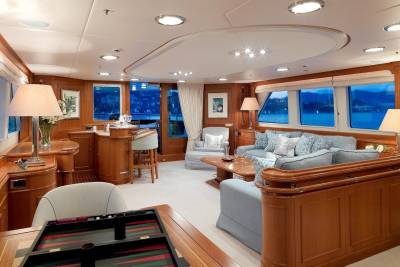 Luxurious yacht interiors offer a serene escape with plush seating and panoramic views of the tranquil waters.