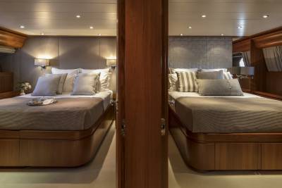 Two luxurious cabins with comfortable beds and elegant decor offer a serene retreat on board.