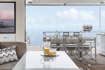 Enjoy refreshing drinks and a barbecue on deck overlooking the serene ocean.
