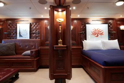Luxurious wood paneling and plush furnishings create an opulent retreat aboard this elegant yacht.
