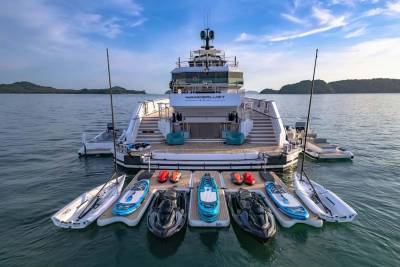 A luxurious yacht named Wanderlust Bikini is fully equipped with a fleet of jet skis and paddleboards for aquatic adventures.