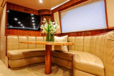 Luxurious leather seating and polished wood create an elegant dining nook aboard this opulent yacht.