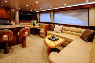 Luxurious yacht interiors feature plush seating, elegant wood finishes, and a well-appointed galley for ultimate comfort at sea.
