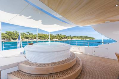 Relax in the luxurious jacuzzi on deck while taking in the stunning coastal views.