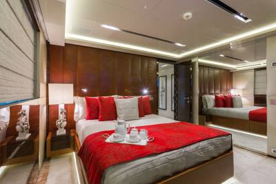 Luxurious yacht accommodations feature plush bedding, elegant decor, and a tranquil atmosphere for ultimate relaxation.