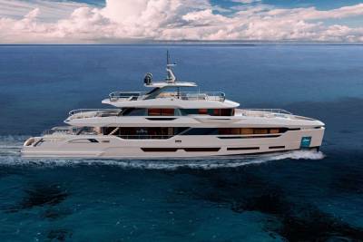 A luxurious white yacht glides through the deep blue ocean under a sky filled with dramatic clouds.