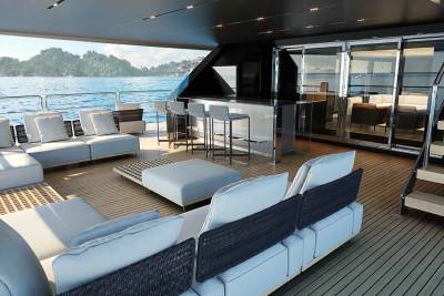 Relax on the spacious deck of this luxurious yacht, surrounded by the tranquil blue waters and lush green islands.