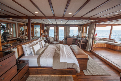 Luxurious wooden interiors and expansive ocean views create a serene retreat aboard this elegant yacht.