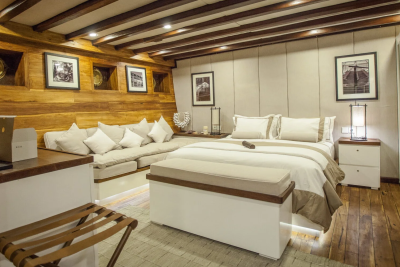 Luxurious wooden interiors and plush furnishings create a cozy retreat aboard this elegant vessel.