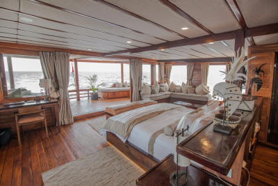 Luxurious wooden interiors and expansive ocean views create a serene retreat aboard this elegant vessel.
