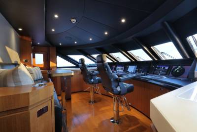 The modern yacht bridge offers panoramic views and advanced navigation systems for a luxurious sailing experience.