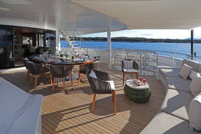 Dine al fresco on the deck of this luxurious yacht, surrounded by the sparkling blue sea and picturesque coastline.