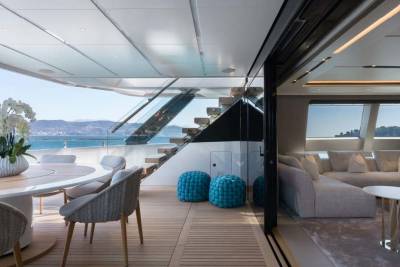 Luxurious yacht interiors seamlessly blend with outdoor living spaces, offering breathtaking ocean views and elegant comfort.